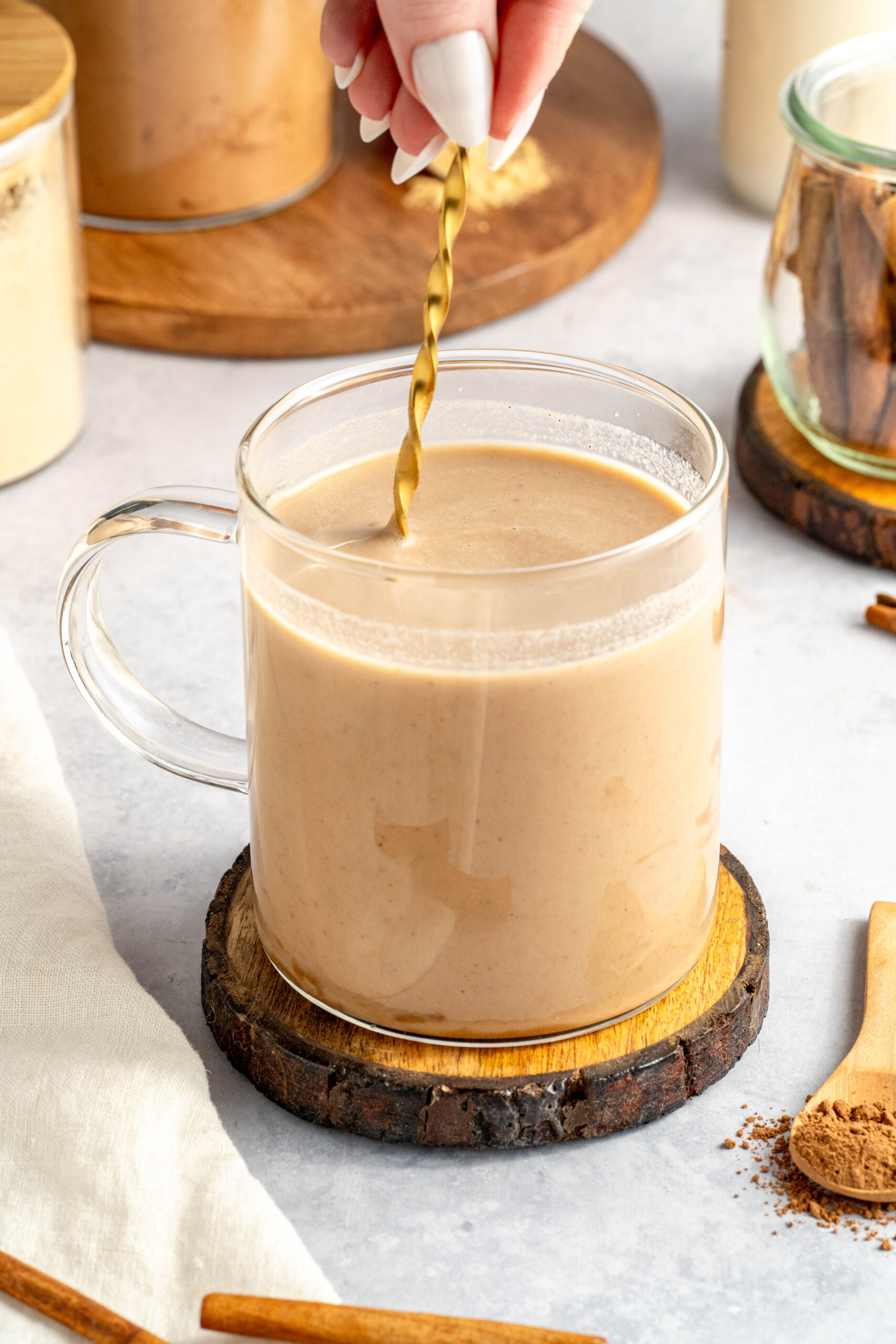 stirring ingredients together to make easy maca latte for healthy hormones