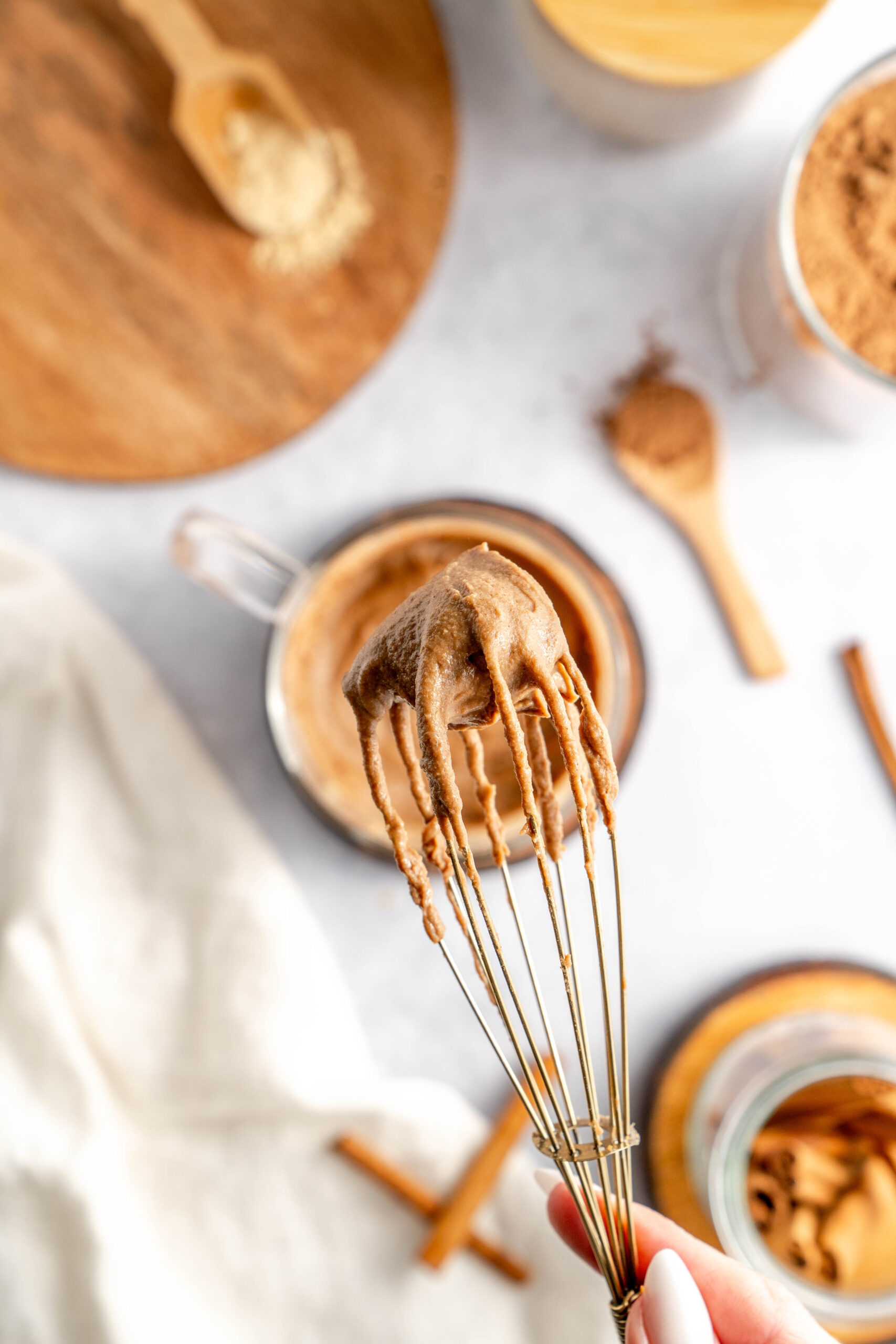 ingredients to make maca latte mixed together to form paste-like mixture.