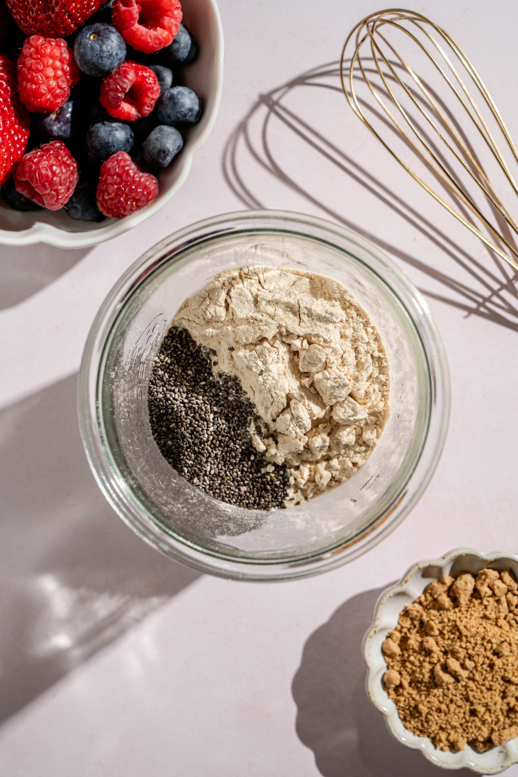 first step in making berry cheesecake overnight oats with adding the dry ingredients