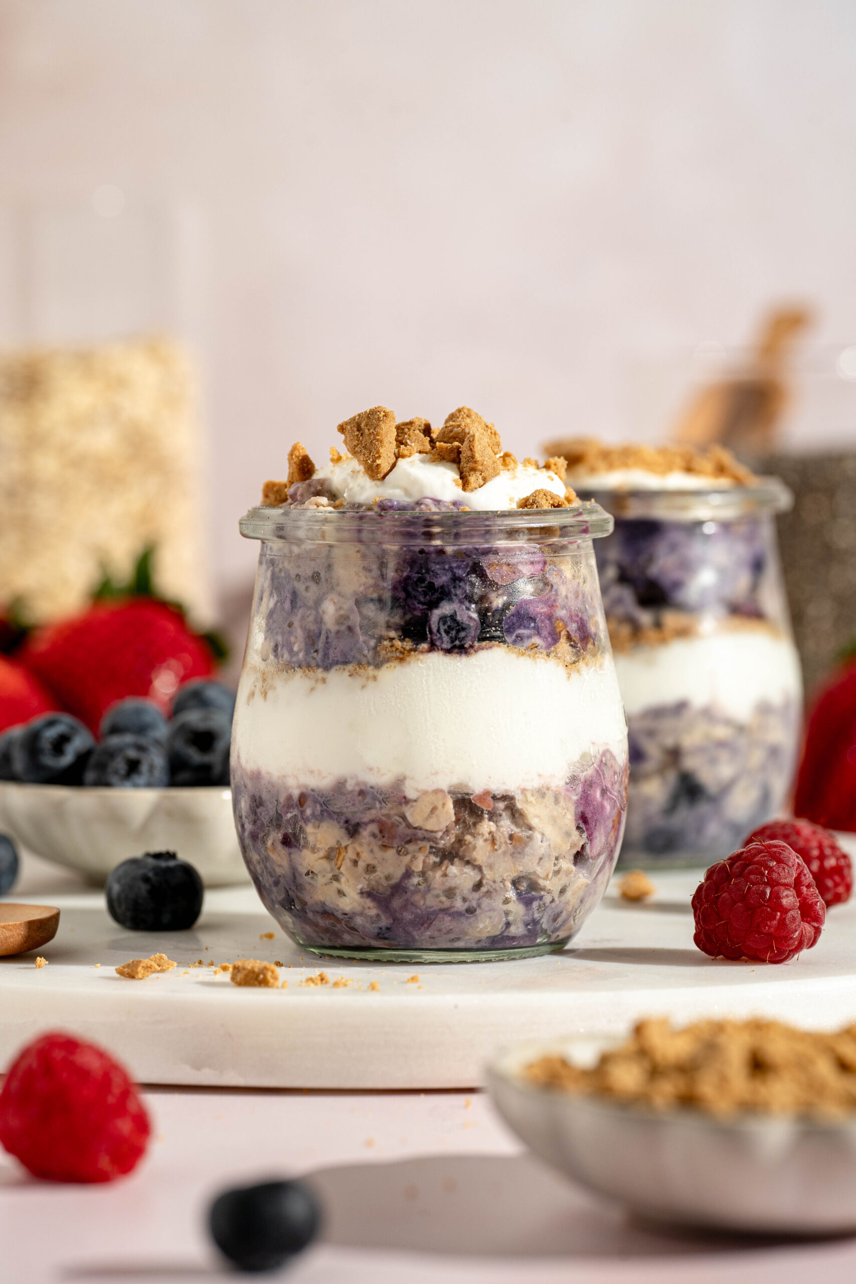 layered berry cheesecake overnight oats with ypgurt and graham crackers